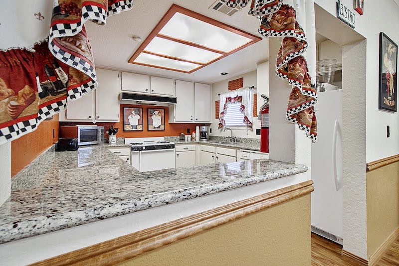 Kitchen Area With Stove and Refrigerator