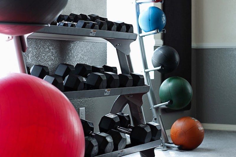 Gym Area with Dumbbells, Medicine Balls, and Yoga Balls