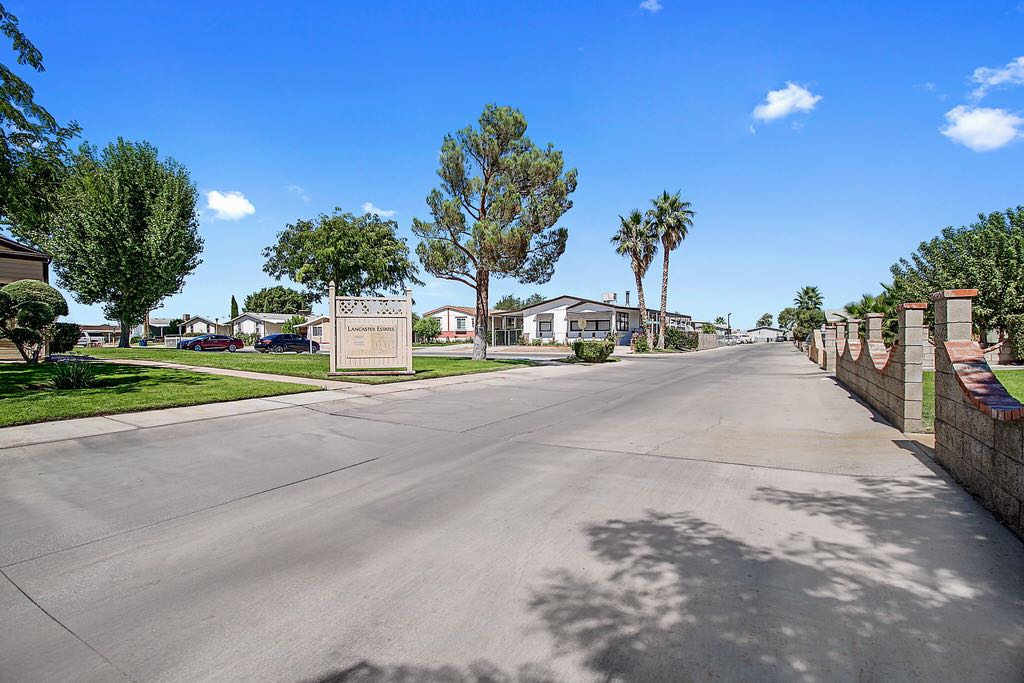 Large Road and Lancaster Estates Sign with Palm Trees