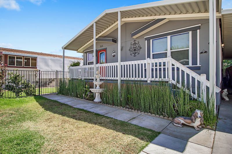 Gray House with White Trim and Grassy Yard