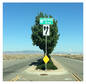 Road sign with text "Musical Road Ahead One Mile"